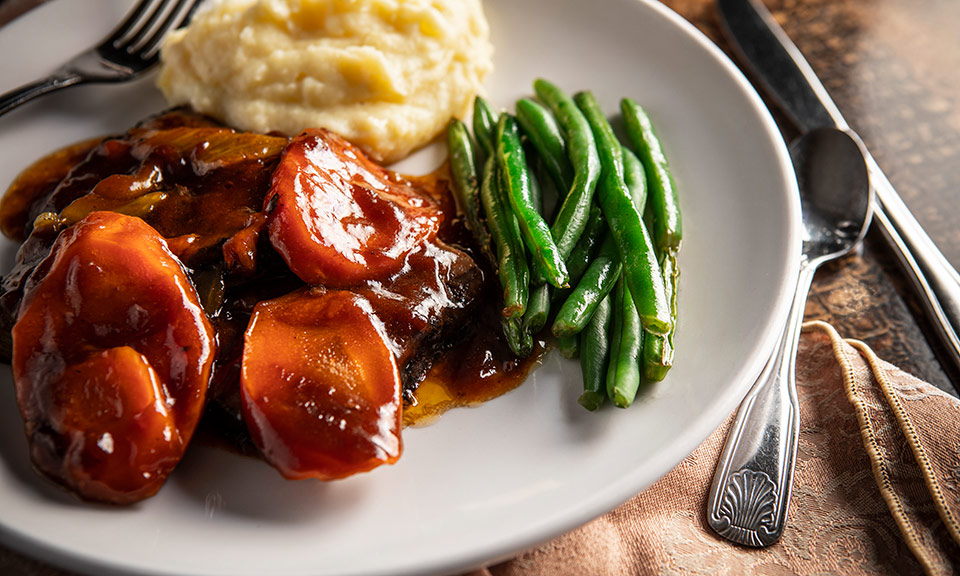 Huckleberry's Restaurant Dinner Meat, mashed potatoes, and green beans
