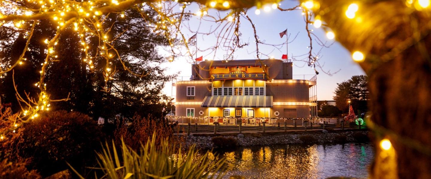 Fulton Steamboat Inn at night with water Fulton Steamboat Inn at night with water